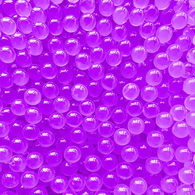 Close-up of purple Boba POPS pearls on a purple background